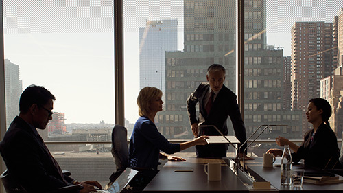 Coworkers sitting at conference tables during meeting