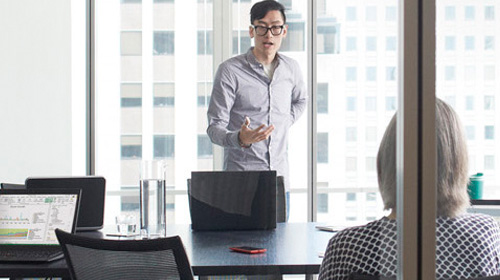 Business conference in front high rise window