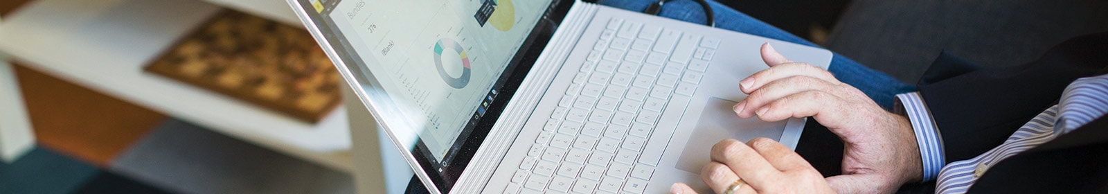 Zoomed in shot of man typing on laptop 