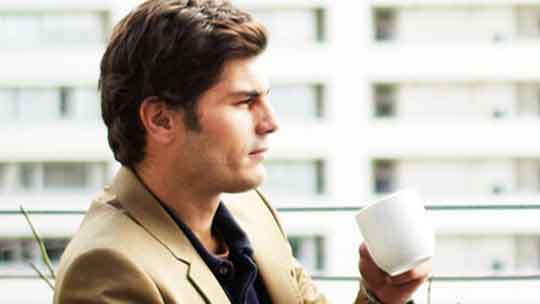 man drinking coffee