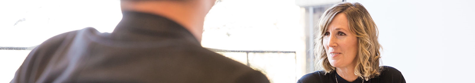 Two people discussing the results of a gold ore sample