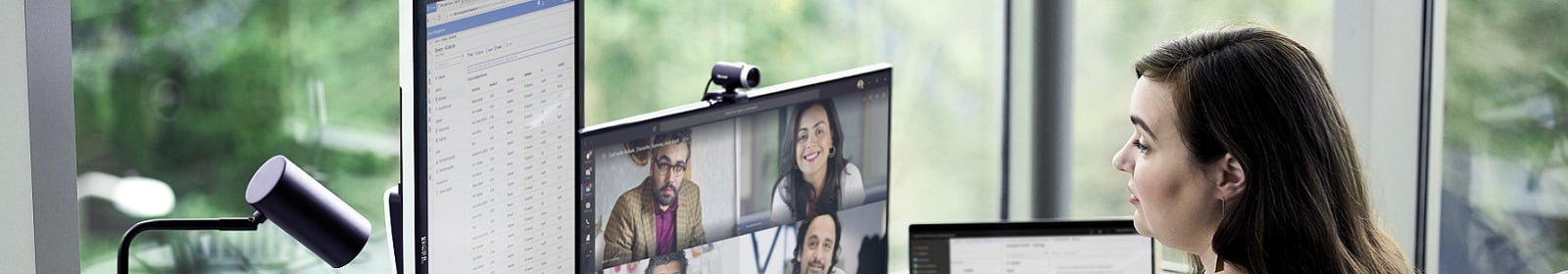 A woman participates in an online meeting