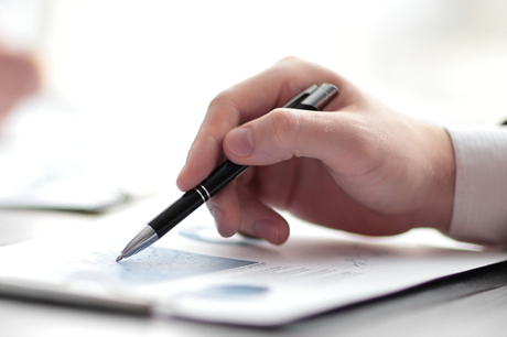 Close up shot of a hand as reader reviews documents