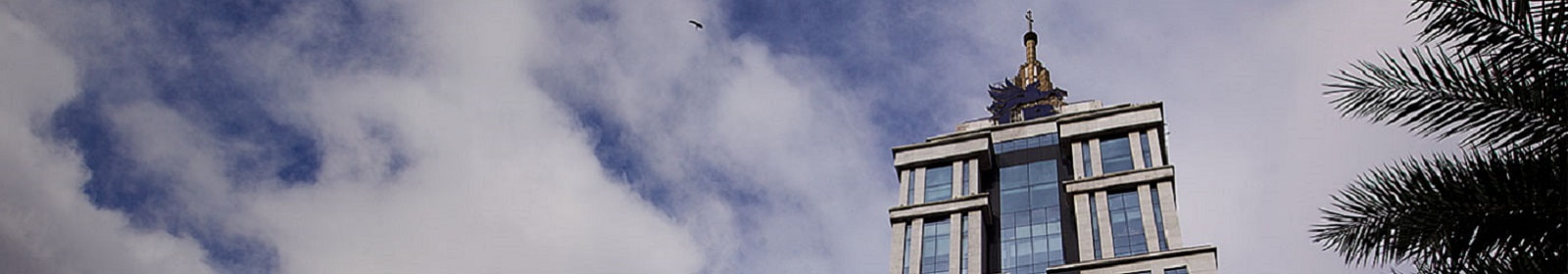 A United Breweries Ltd. building towers above a palm tree