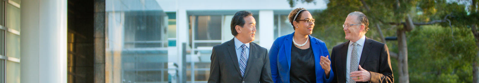 Three people walking. 