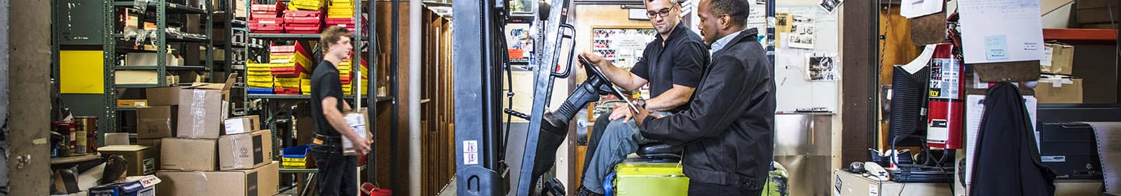 Warehouse workers view operations data on tablet