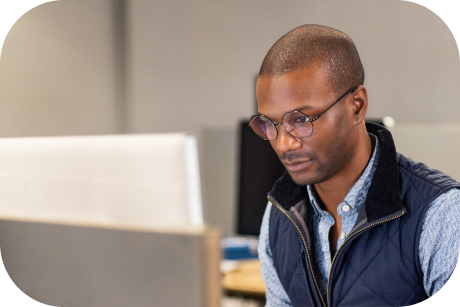 A person looking at a computer screen