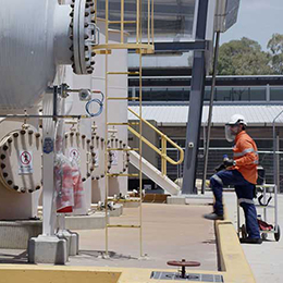 Man working outside on large machine