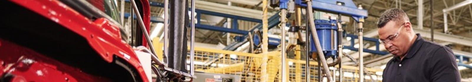 A man works in a manufacturing plant