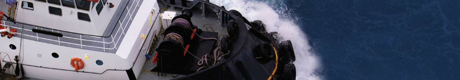 A boat sails through the ocean