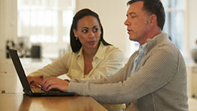 Two marketing professionals accessing digital assets