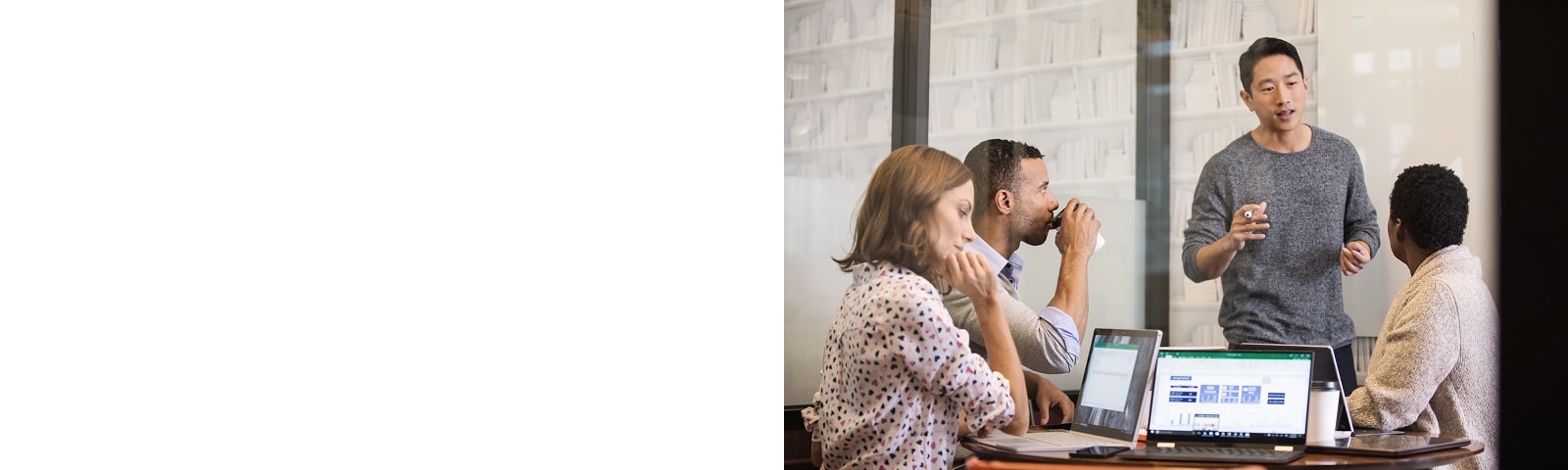 A meeting room with people collaborating