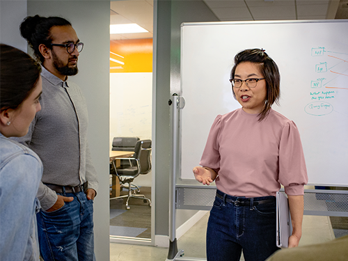 Group of three person having a discussion