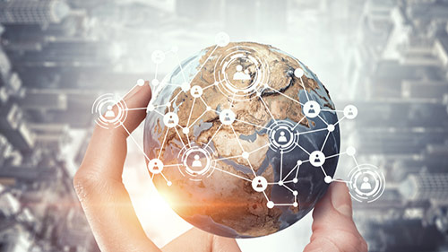 a hand holding globe