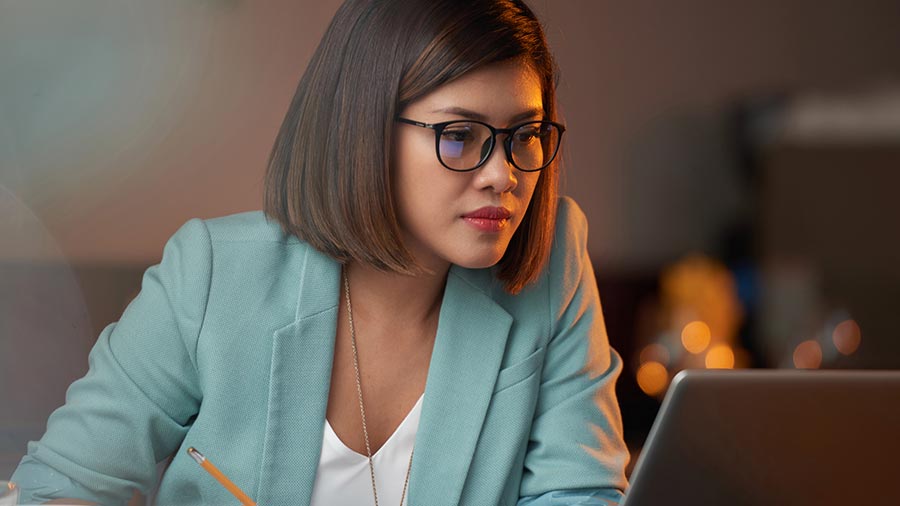 A woman looking at laptop