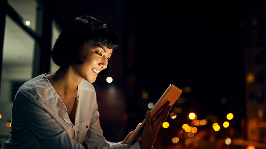 A woman looking at tablet