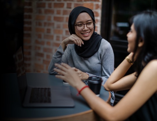 Two women are in conversation
