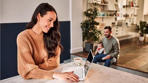 A picture containing indoor, woman, sitting, man