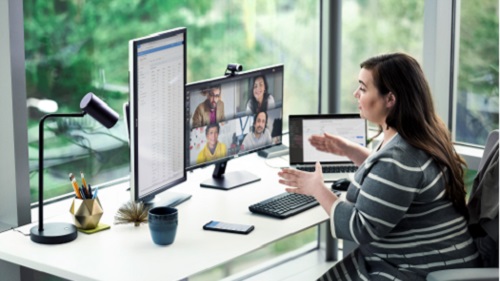 A woman with her laptop attending a Teams meeting