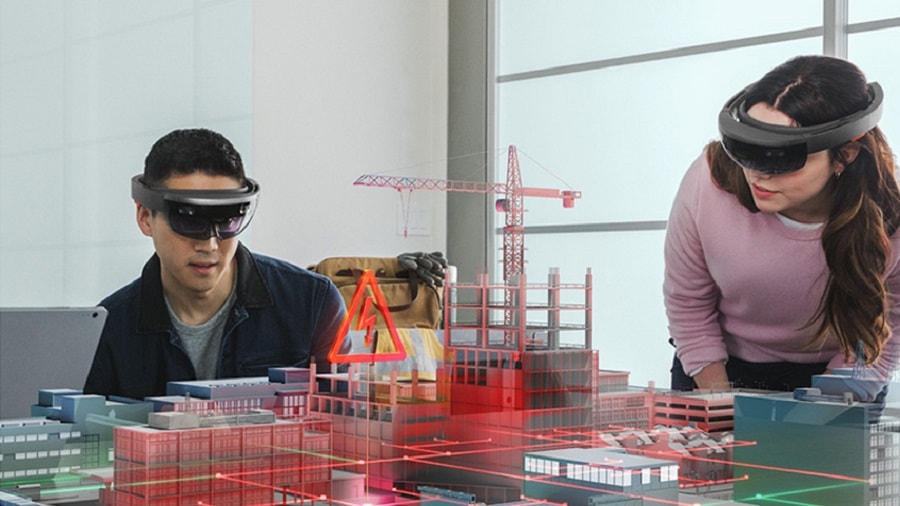 man and woman working on AI