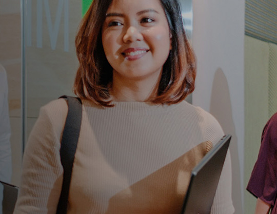 woman smiling at colleagues