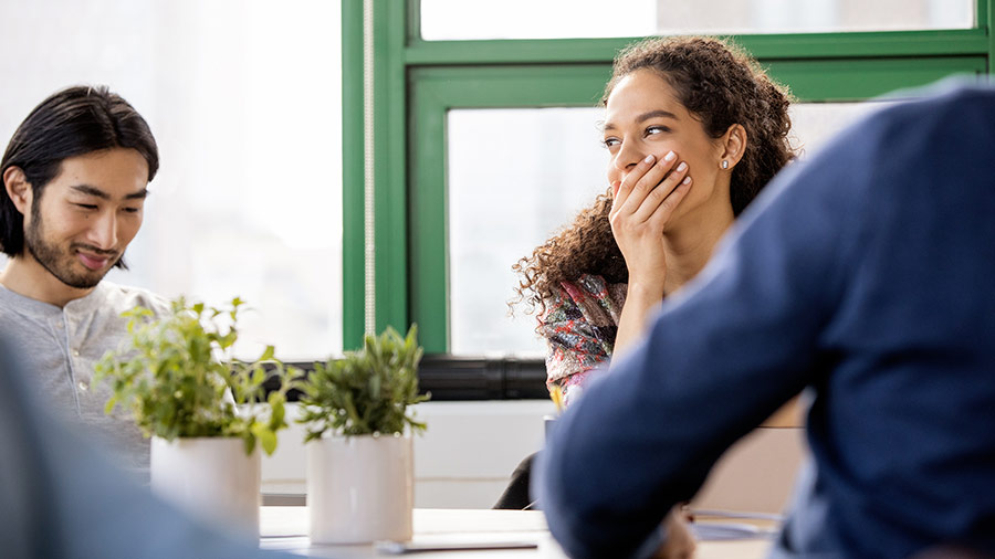 Three people are in converstion