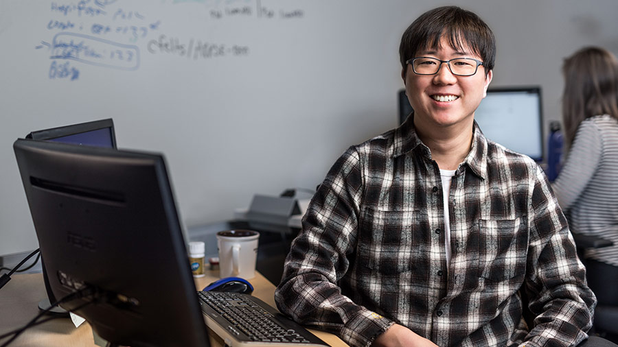 man sitting and smiling