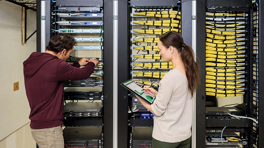 man and woman stacking servers