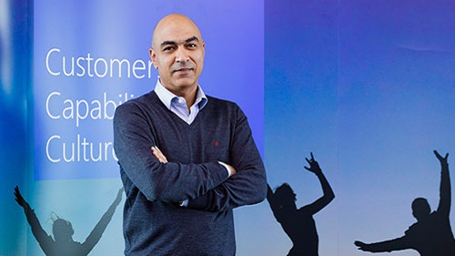 man standing in front of presentation