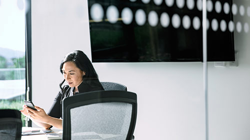 woman looking at mobile phone