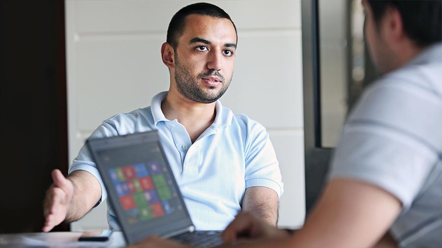 Two men are in converstion