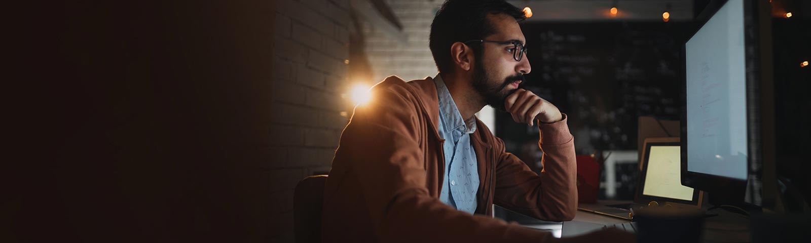 Man with spects working