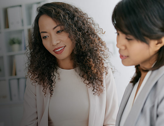 Two women are in conversation