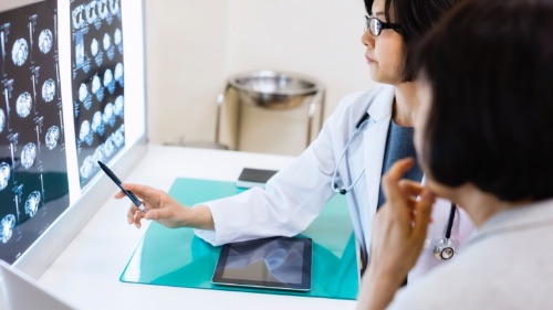 Doctor points towards screen