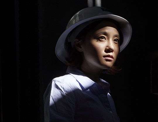 Standing woman carried laptop