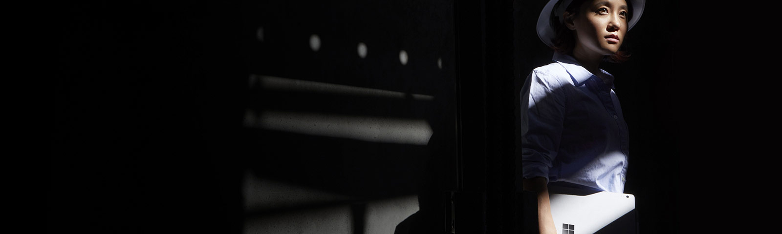 Standing woman carried laptop