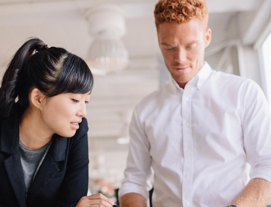 A man and a woman are in discussion