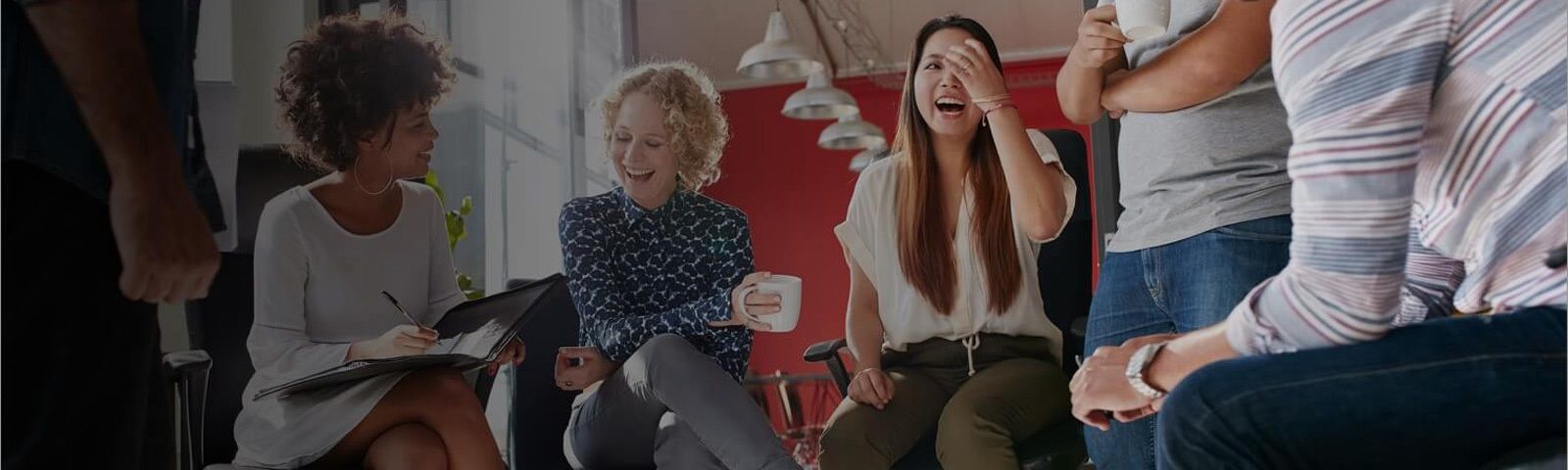 A group of people are talking and laughing