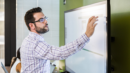 Man working on touch screen