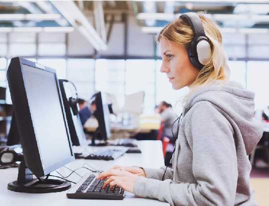 Working on desktop with headphone