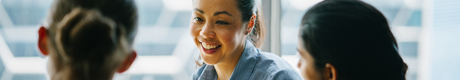 Female smiling in a group of people
