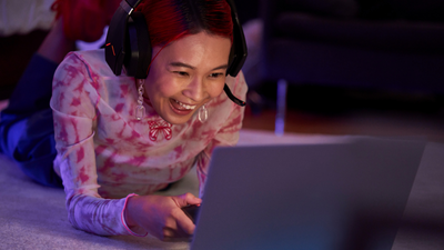 Woman gaming on her laptop