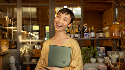 Woman holding her laptop