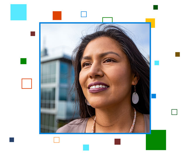 A portrait of a woman smiling, surrounding her are colorful #BuildFor2030 pixels