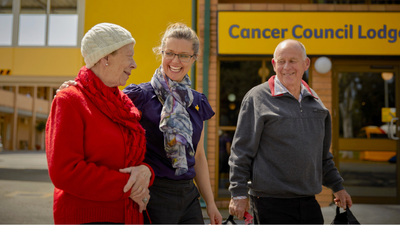 A women assisting an elderly couple