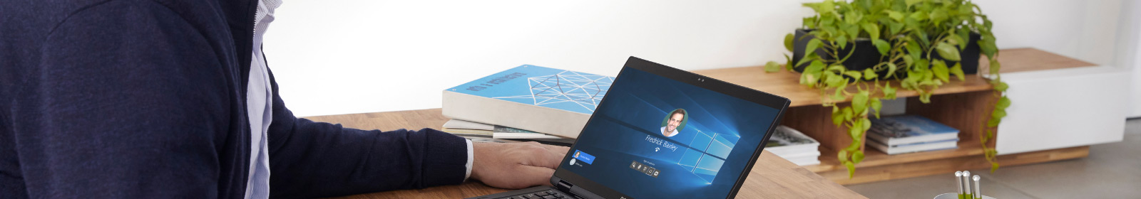 Business account manager logging into his laptop with Windows Hello