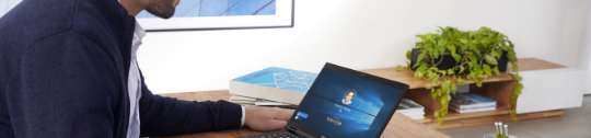 Business account manager logging into his laptop with Windows Hello