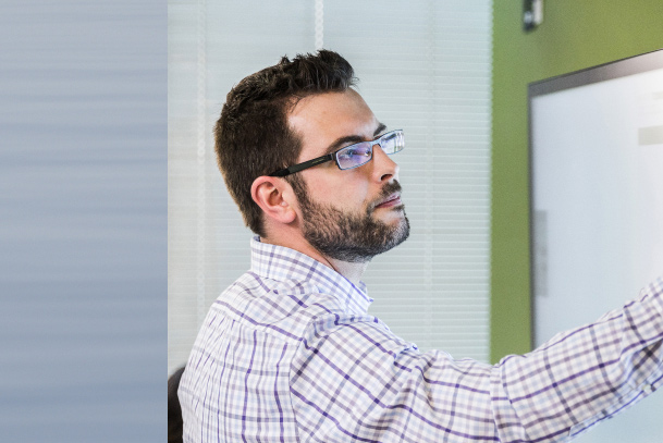 Person writing on a whiteboard