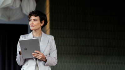 Female holding a Surface device