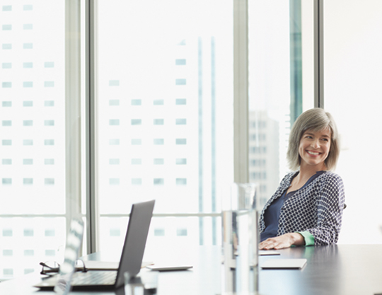 A woman in a conference room 